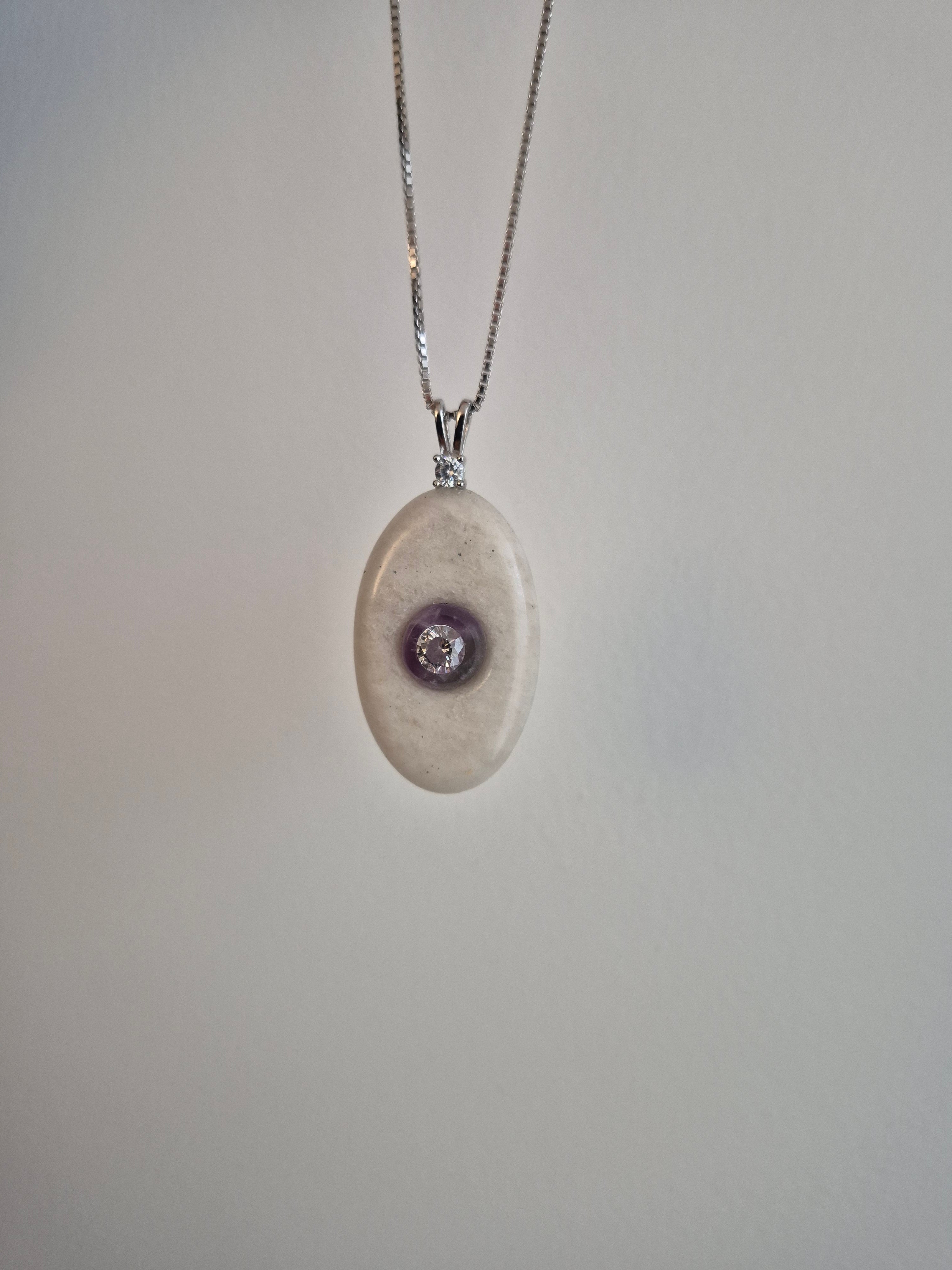 Oval stone pendant with CZ mounted on amethyst