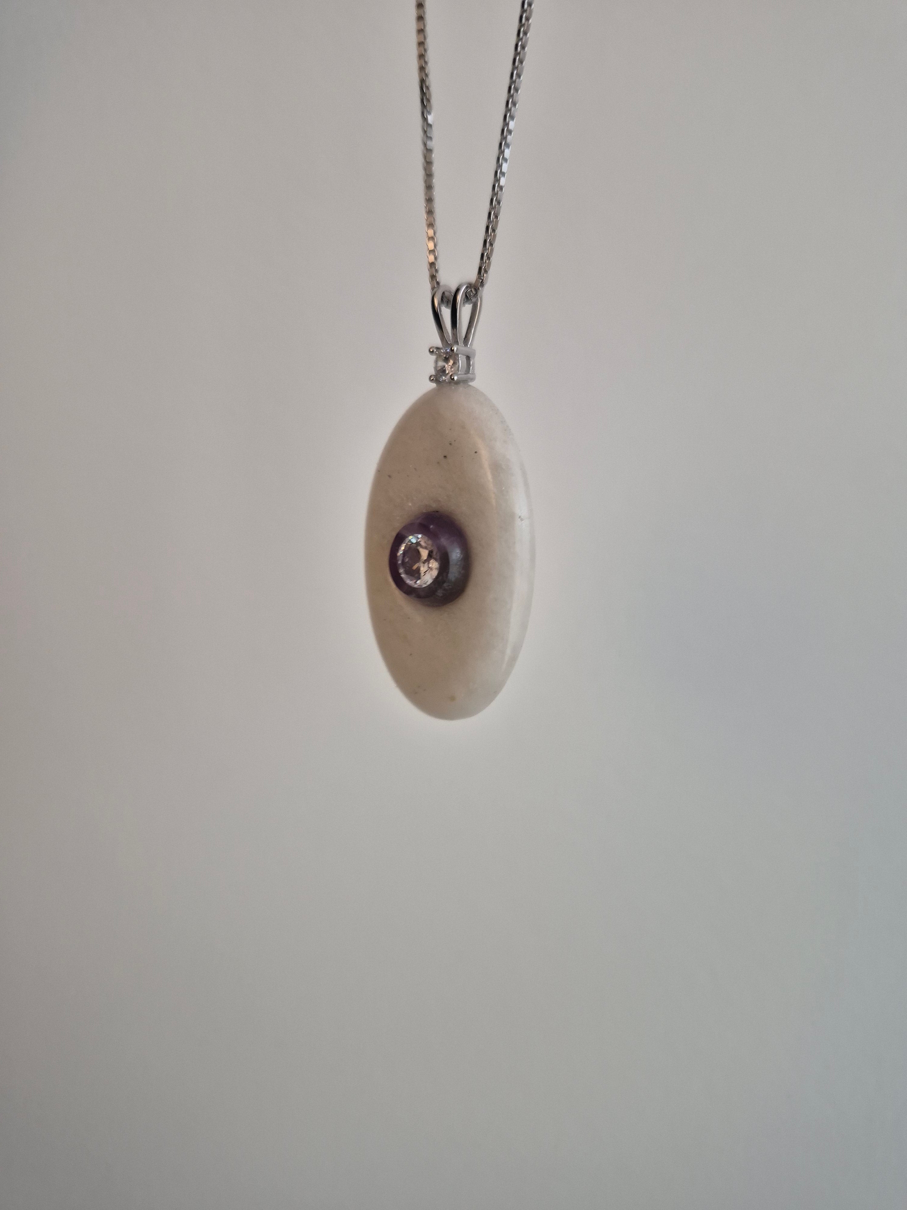 Oval stone pendant with CZ mounted on amethyst
