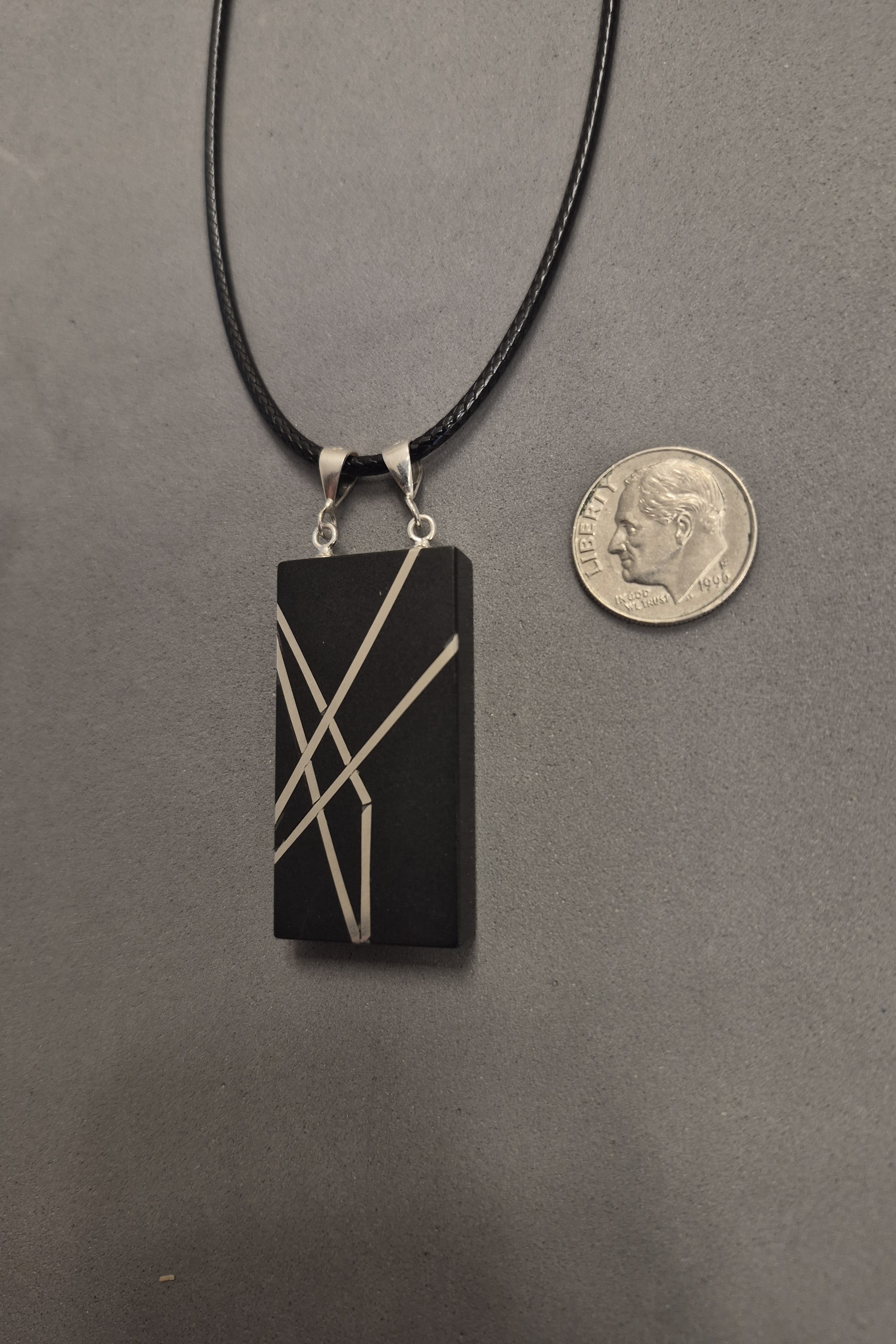 Geometric silver on black necklace