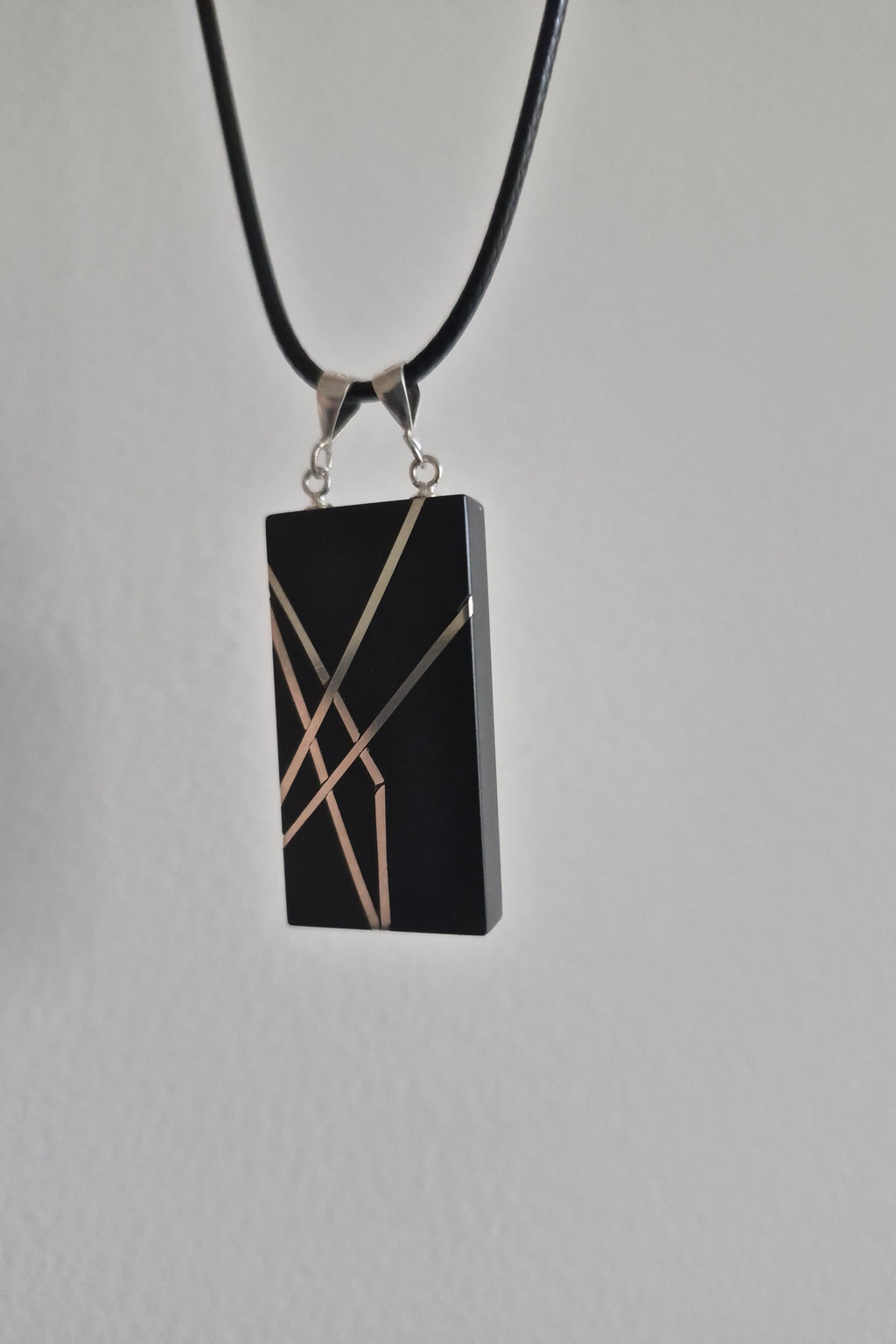 Geometric silver on black necklace