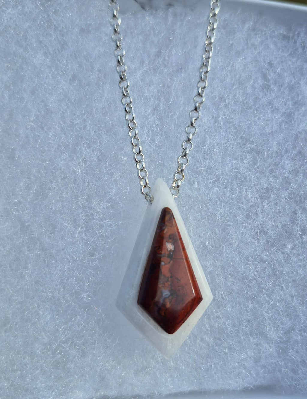 Kite-shaped pendant brown on white base art deco inspired